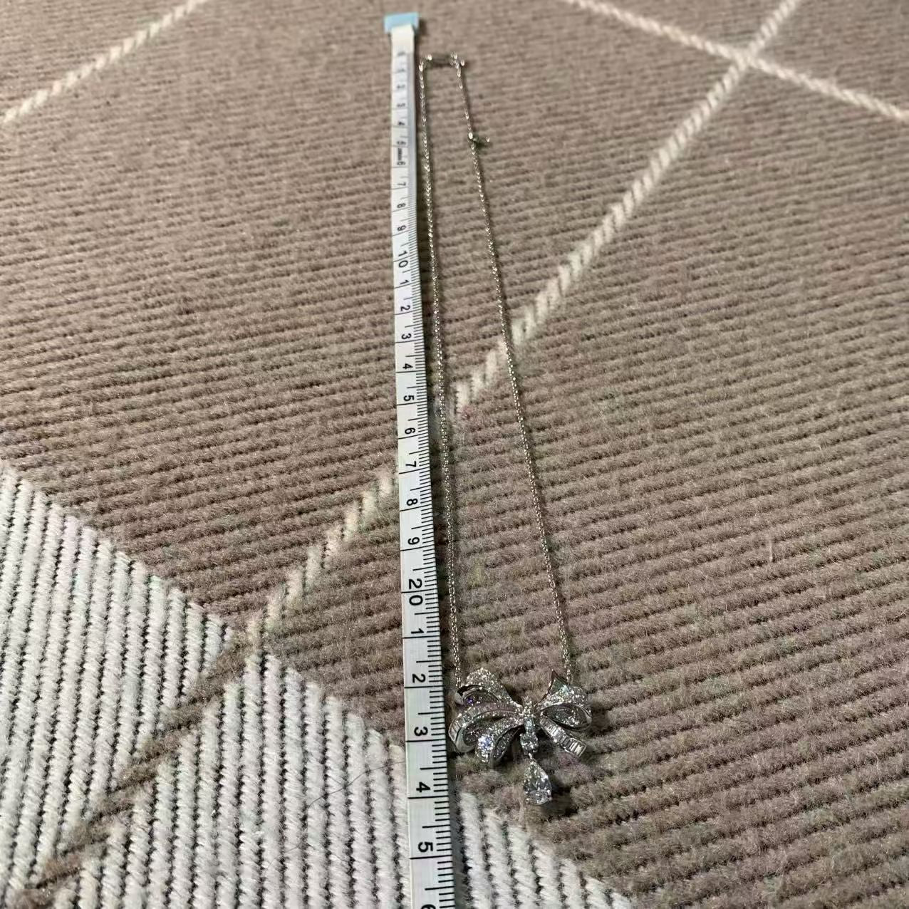 Graff Tilda's Bow Collection 18K White Gold Full Diamond Bow Necklace, 0.7-carat teardrop-shaped main diamond, 2023 complete set.